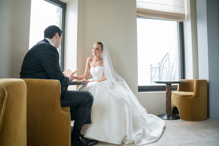bride is staring at her groom as they exchange wedding vows